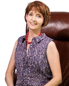 Photograph of appraiser Laura Duguid seated in a chair