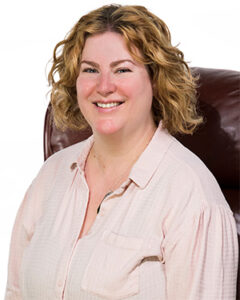 Photograph of appraiser Alexandra "Lex" Huckabay seated in a chair