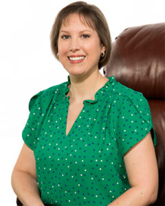 Photograph of appraiser Carrie Young seated in a chair